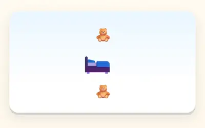 A teddy above a bed and another teddy below it.